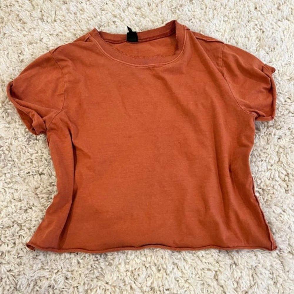 brownish-orange shirt